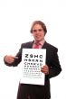 business man with eye test chart