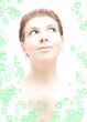 hi-key redhead with green eyes in water with flowers