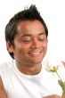 man looking at rose