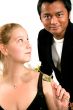 man gives rose to woman