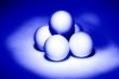 four white balls for table tennis