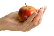 Holding an apple