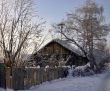 snow-capped log cabin