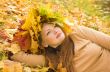 Portrait of the girl in a wreath from maple leaves