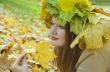 Portrait of the girl in a wreath from maple leaves