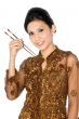Beautiful asian girl playing with chopsticks