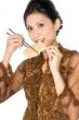 Eating healthy biscuit with chopsticks