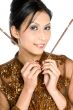 Beautiful asian girl playing with chopsticks