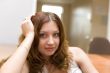 Smiling pretty brunette in a room #2