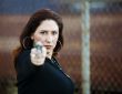 Hispanic Woman with Handgun