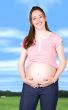 happy pregnant woman outdoors