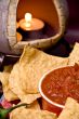 closeup of candle, chips and salsa