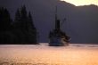 An old steamboat on mountain lake.