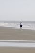 Woman Walking on Beach-Vertical