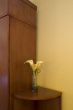 Edge of armoire and artificial flower