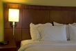 Corner of bed and pillows