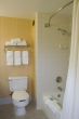 Bathroom with open shower curtain