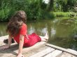 A young girl sits on the bridge