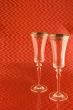 Two Champagne Glasses on Red Background