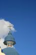 Blue cloudy sky with with blue church cupola