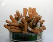 Pile of cigarette butts in ashtray
