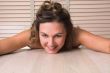 Pretty woman lying flat on the table