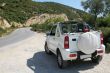 Little white jeep on an island
