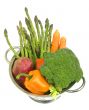 Fresh vegetables in a colander on white isolated