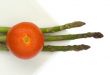 Tomato and asparagus in a white plate