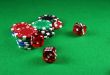 An Action shot of 5 dice thrown onto the table