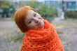 young red-haired woman in red scarf