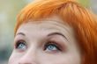 blue eyes of red-haired woman