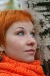 young red-haired woman in red scarf