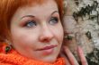 young red-haired woman in red scarf