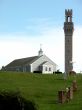 Church with bell tower on hill