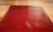 pasport in cover on table