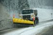 Snowplow clearing road