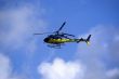 Yellow-blue Helicoper in the sky