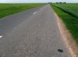 asphalt road and rural field
