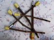 wooden flutes resting upon fabrics