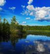 evening lake, clouds are reflected in water