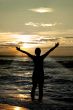 worshipper against incredible summer sunset