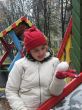 The girl with snowball in winter