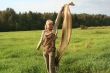 young woman with scarf in a field