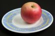Red apple on a saucer