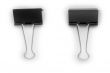 Two black metal clips