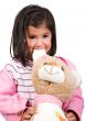 little girl playing with her teddy