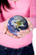 hands holding globe