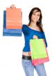 beautiful girl in blue with shopping bags