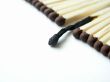 Burnt match on backround with matches